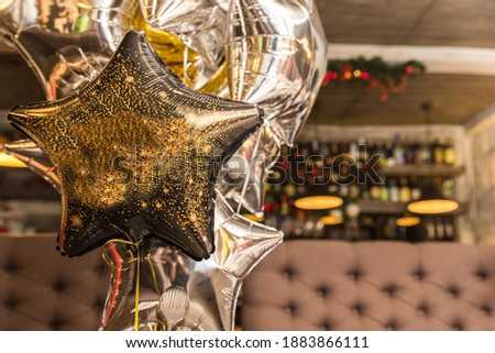 
Black ball in the form of a star in a restaurant with a place for the text.
