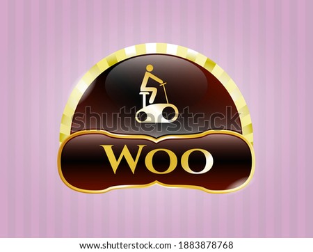 Gold shiny emblem with stationary bike icon and Woo text inside