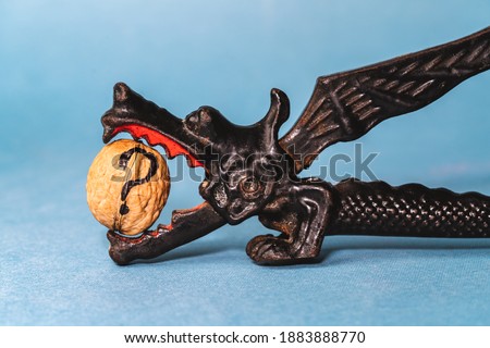 dragon shaped nutcracker with a nut in its teeth