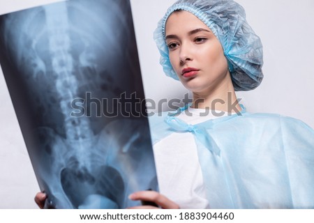 woman raising her hand up and holding an x-ray picture doctor medicine, woman raising her hand up and holding an x-ray picture doctor medicine