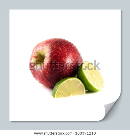 Isolated red apple with sliced lime on a white background (water drops). Fresh diet fruit. Healthy fruit with vitamins.