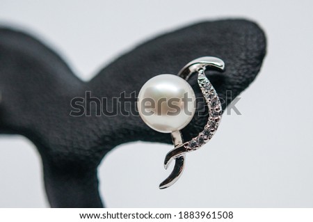 Earrings decorated with diamonds and pearls that look beautiful and luxurious Royalty-Free Stock Photo #1883961508