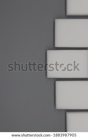 white product mockups on the gray surface. geometric shapes