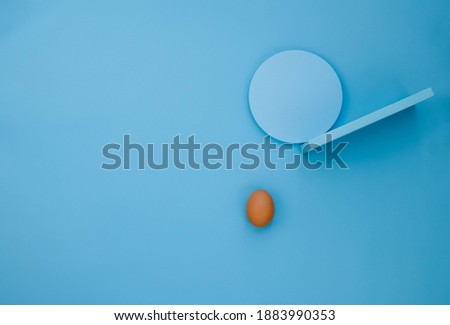 Still life photography. illustration of unbalanced life from props photo round shape and red egg. Creative designer desk