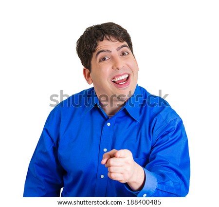 Closeup portrait laughing, handsome, excited, happy man pointing at you camera gesture with finger, isolated white background. Positive human emotion facial expression, feeling, signs symbols