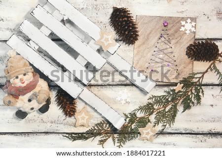 Decorative winter sleigh. White sleigh. Christmas decor. Christmas composition. Good New Year spirit