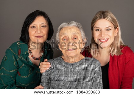 Picture of happy women generations in a family - granddaughter, mother and grandmother - indoor photography