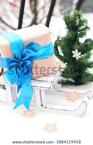 Decorative winter sleigh. White sleigh. A gift on a sleigh. Christmas decor. Good New Year spirit
