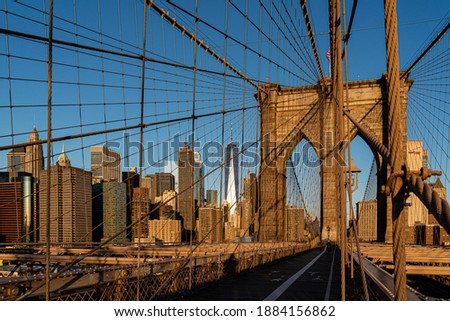 Empty Brooklyn Bridge in winter in New York City during Coronavirus-19 pandemic