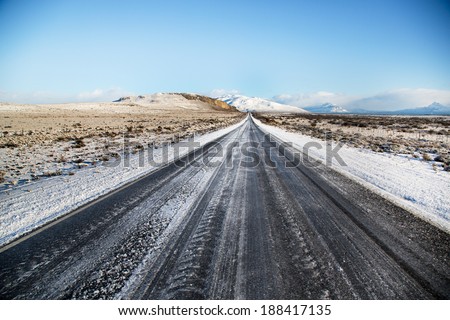 Beautiful road with snow in a blue sky day and near by the Perito Moreno in El Calafate, Patagonia Argentina