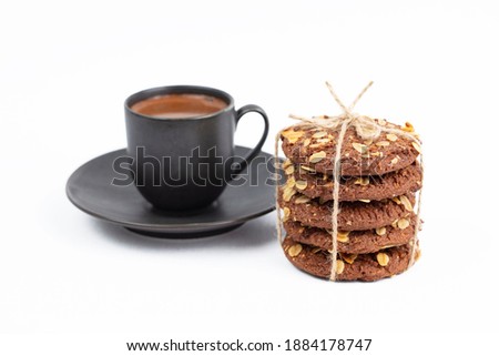 delicious cookies and a cup of coffee. Isolated on white background