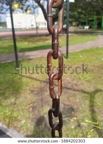 An image of rusty steel at the playground.Exposure of the water and oxygen can cause this.Image snapped using smartphone.