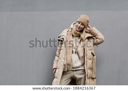 Woman standing outdoor. Color of the year 2021: ultimate gray. Trendy colors concept, mockup with copy space Royalty-Free Stock Photo #1884216367