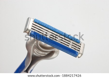 Up close a Razor Blade on white background with selective focus.

 Royalty-Free Stock Photo #1884217426