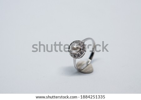 Gold and silver rings decorated with pearls and diamonds Royalty-Free Stock Photo #1884251335