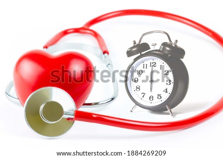 Red Stethoscope,shape Heart and clock Isolated On White Background.Blood pressure control-Health care concept Royalty-Free Stock Photo #1884269209