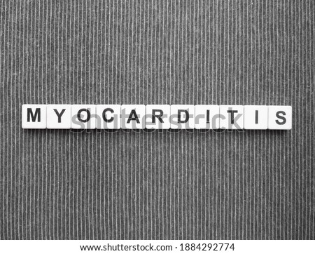 Myocarditis, word cube with background.