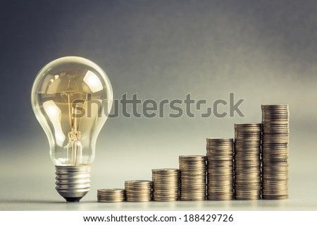 Light bulb with heap of coins stairs for financial plan or business idea concept Royalty-Free Stock Photo #188429726