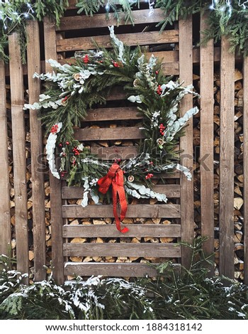 Christmas fir wreath on wooden background 