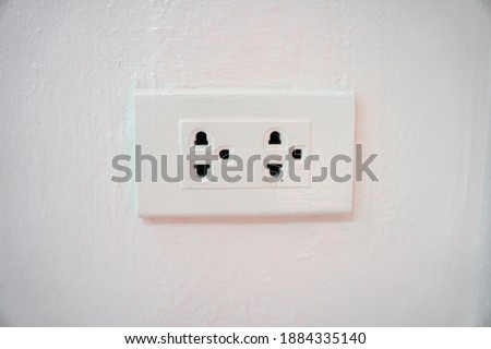 Electrical switch, socket-outlet for outlet on wall.