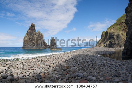 River mouth of Ribeira da Janela, boulder beach and ocean rocks. Madeira, Portugal.