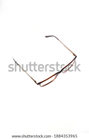 Gloss brown square eyeglass frame in the photo from above to the right on a white background