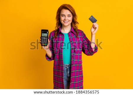 Photo of attractive person arms hold terminal debit card wear plaid magenta isolated on yellow color background