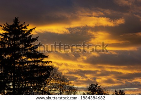 sundown colorful sky at winter evening in south germany countryside