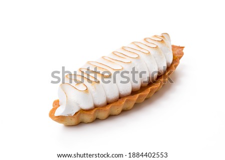 Lemon tart with meringue topping isolated on white