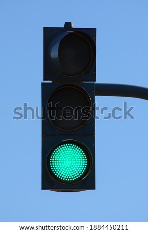 A city crossing with a semaphore. Green light in semaphore Royalty-Free Stock Photo #1884450211