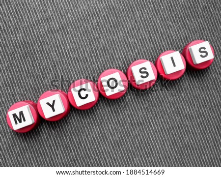Mycosis, word cube with background.