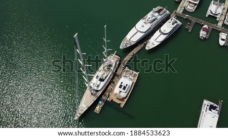 Monohulls and powerboats on the dock at Phuket,Thailand Royalty-Free Stock Photo #1884533623