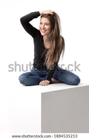 Portrait of a happy and beautiful young smiling woman. Isolated image on the white studio background.