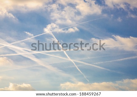Blue sky with plane trails taken over Zaventem airport in Brussels Royalty-Free Stock Photo #188459267