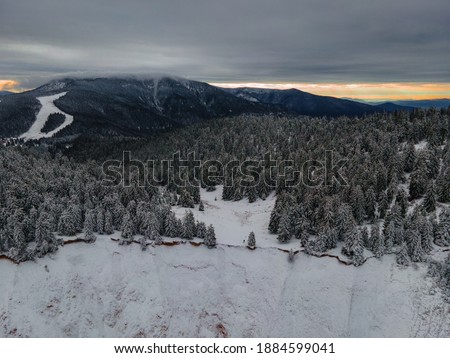 Groapa Ruginoasa located in Apuseni mountains, Romania. A shot from a higher angle, above a canyon, with forest and mountains in the background