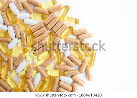 Different pills capsules pills on white isolated background