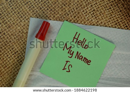 Hello My Name Is write on sticky notes isolated on Brown burlap laying on table