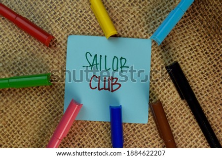 Sailor Club write on sticky notes isolated on Brown burlap laying on table