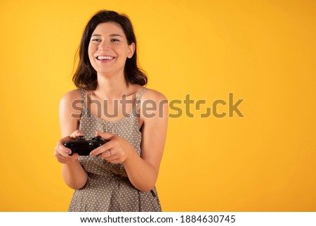 woman playing funny console happy