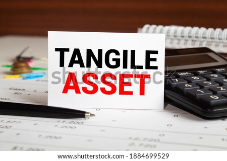 Tangible Asset text written on a notebook with pencils. Royalty-Free Stock Photo #1884699529