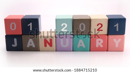 New Year.January 01 - from wooden blocks with letters,  white background random letters around