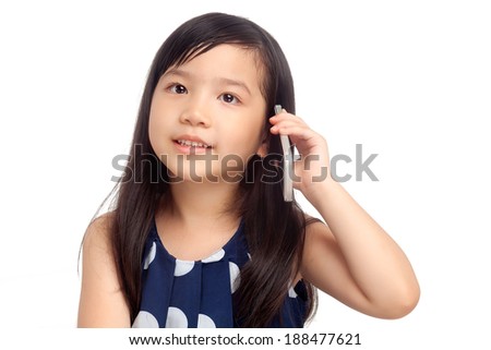 Kid talking on mobile phone on white background