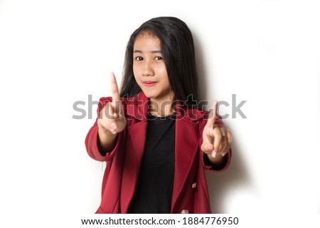 Asian woman making stop gesture with her hand isolated on a white background
