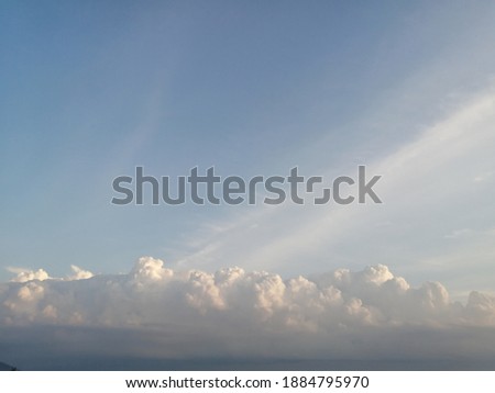 White clouds on the background of the morning sky.