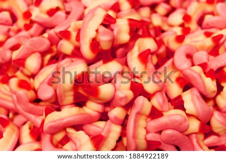 Candy A lot of sweets. Colorful texture using a background. Background rendering. Bright multiple jelly candies in powdered sugar. Confectionery wallpaper concept. Copy space. Shallow focus. Close-up