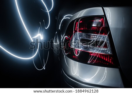 Back photo of a car captured by light painting