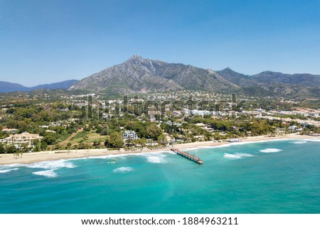 Beautiful and unique aerial perspective of luxury and exclusive area of Marbella, golden mile beach, Puente Romano Bridge. Luxury Clubs, Urbanisation in the most expensive area of Marbella. Mountain Royalty-Free Stock Photo #1884963211