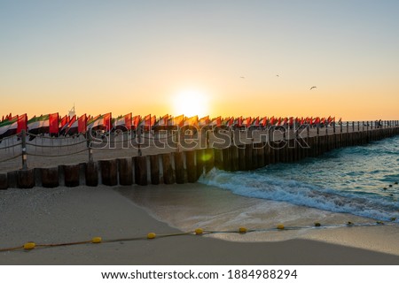 UAE Flag Day celebration with set up of Flag Garden, located at Kite Beach, Dubai. 4000 flags were used  to make portraits of leaders. Shot at sunset time.