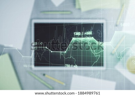 Multi exposure of creative statistics data hologram and digital tablet on background, top view, stats and analytics concept