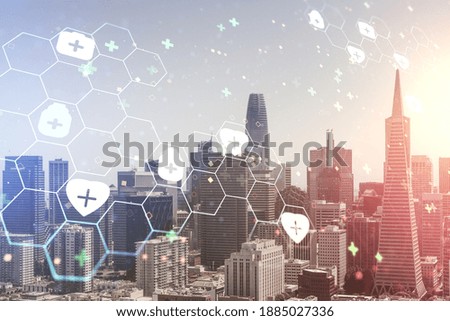 Double exposure of abstract virtual medical hologram on San Francisco city skyscrapers background. Healthcare technolody concept